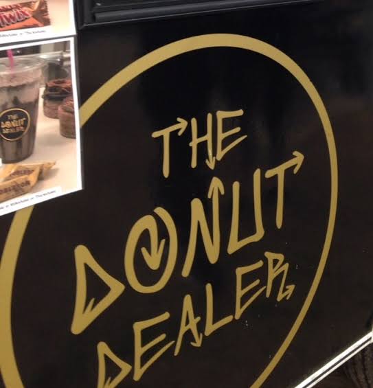 Cut gold vinyl for The Donut Dealer on a black cart