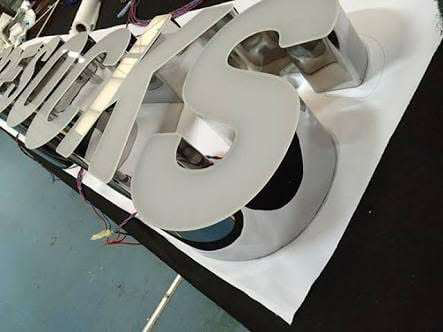 Fabrication detail, stainless channel letters in the workshop