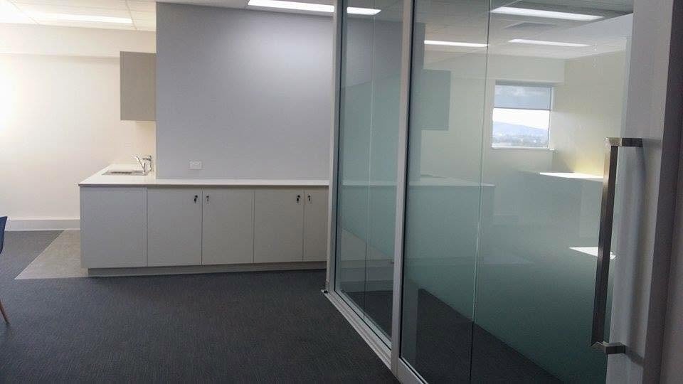 Frosted film bands on glass office partitions