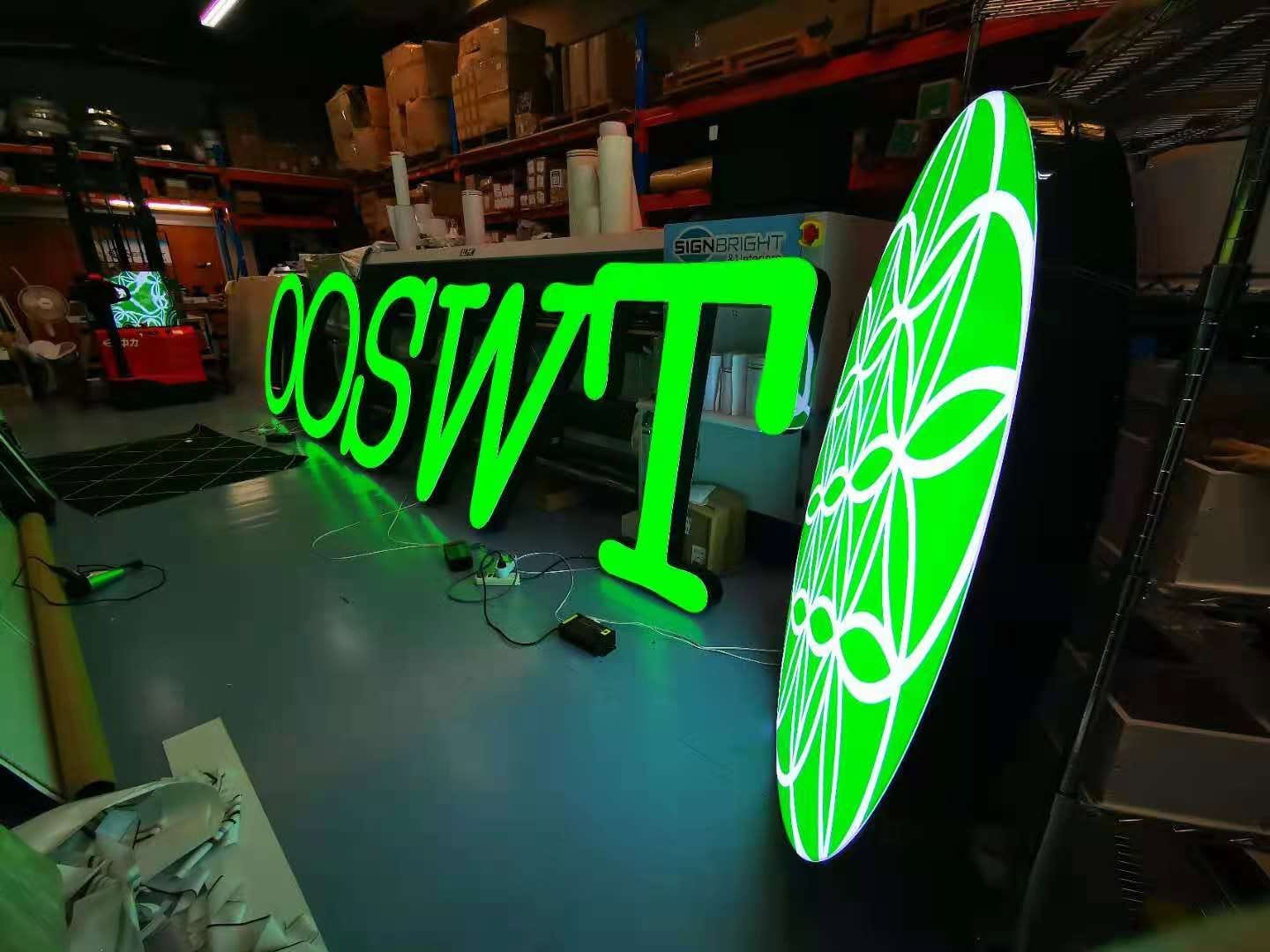 Illuminated letters and logo lightbox under test in the workshop